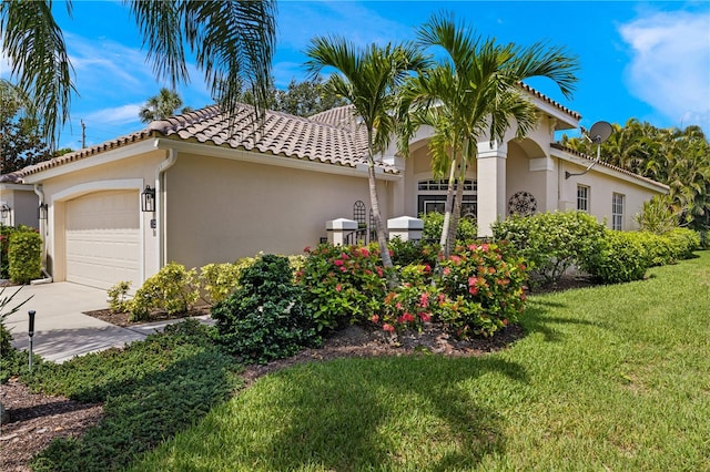 view of home's exterior featuring a lawn and a garage