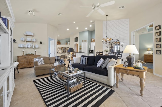 tiled living room featuring ceiling fan with notable chandelier and high vaulted ceiling