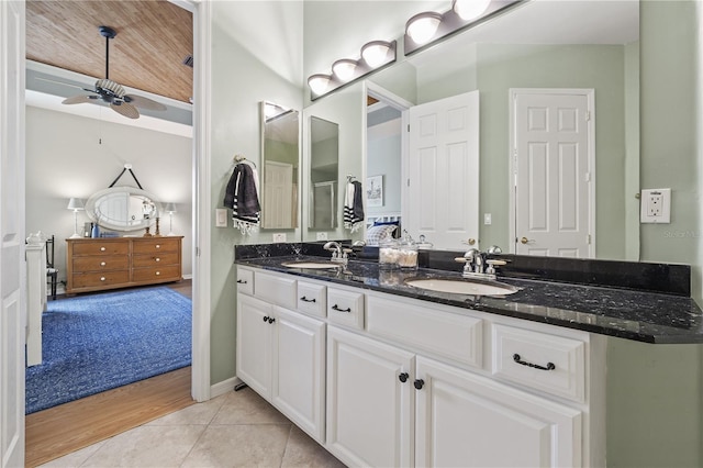 bathroom with tile patterned floors, ceiling fan, and vanity