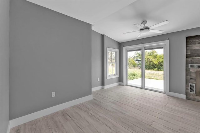 unfurnished room with ceiling fan and light hardwood / wood-style floors