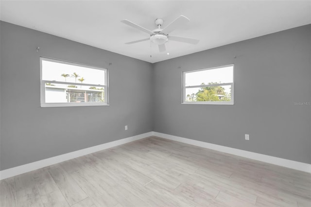 unfurnished room with ceiling fan