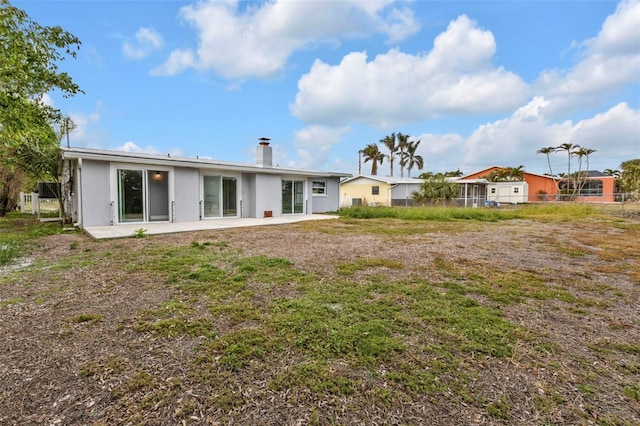 back of house featuring a patio