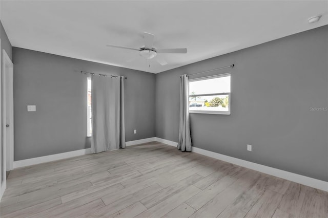 unfurnished room featuring ceiling fan and light wood-type flooring