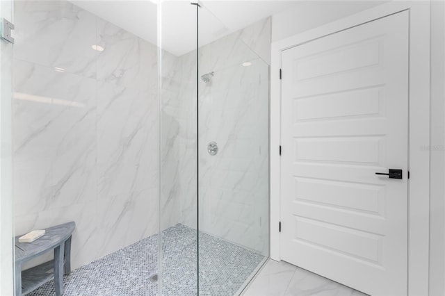 bathroom featuring tiled shower