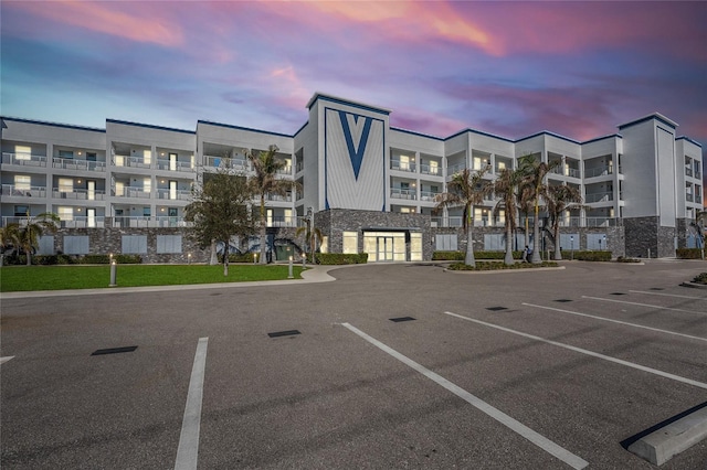 view of outdoor building at dusk