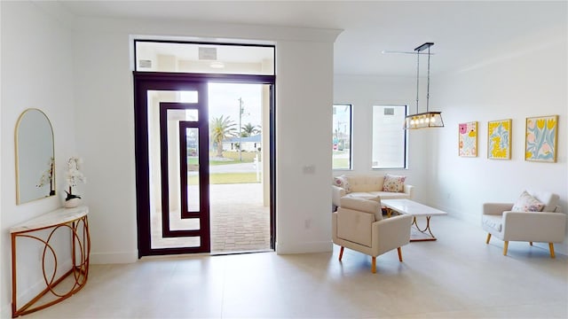 entrance foyer featuring an inviting chandelier