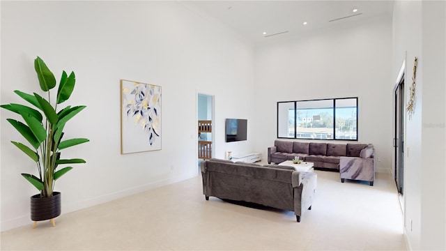 living room featuring a high ceiling