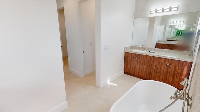 bathroom featuring a tub and vanity