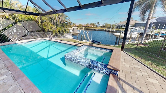 view of pool with an in ground hot tub, a water view, and a boat dock