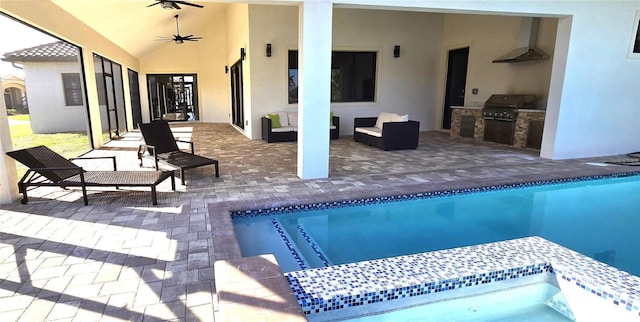 view of pool with ceiling fan, area for grilling, a patio, and grilling area