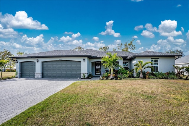 view of front of house featuring a garage and a front yard