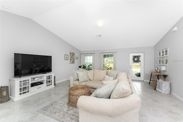 living room featuring vaulted ceiling