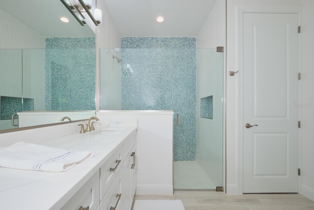 bathroom featuring vanity and walk in shower