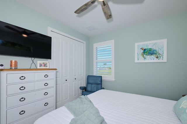 bedroom featuring ceiling fan and a closet