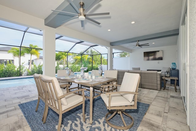 view of patio / terrace featuring outdoor lounge area, ceiling fan, glass enclosure, and a pool