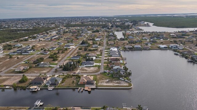 aerial view at dusk with a water view