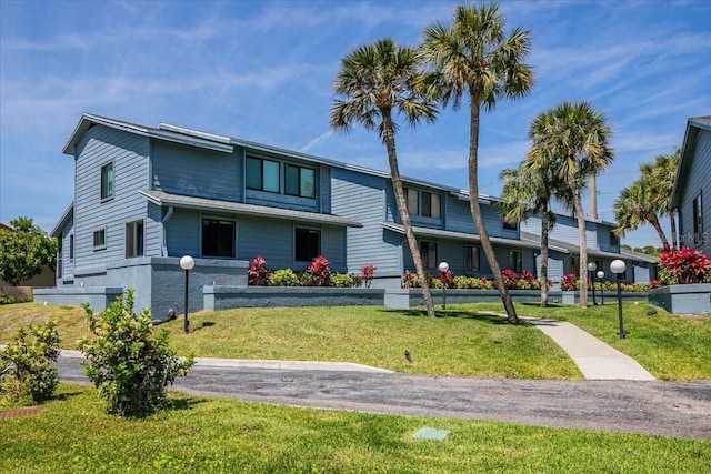 exterior space with a front lawn