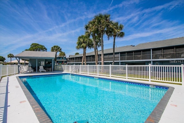 view of swimming pool with a patio