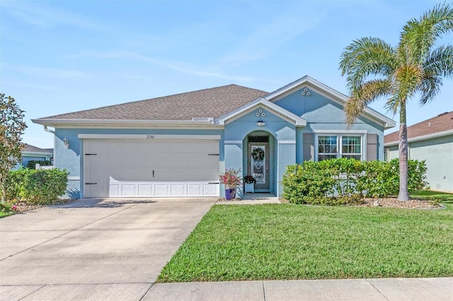 single story home featuring a front lawn and a garage