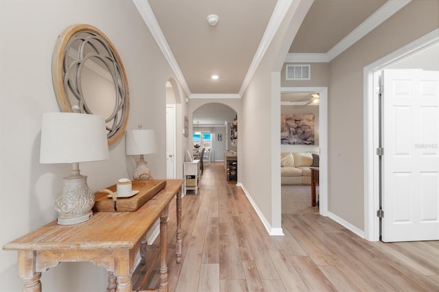 hall featuring light hardwood / wood-style flooring and ornamental molding