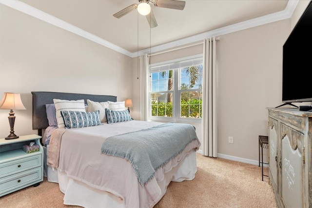 carpeted bedroom with ceiling fan and crown molding