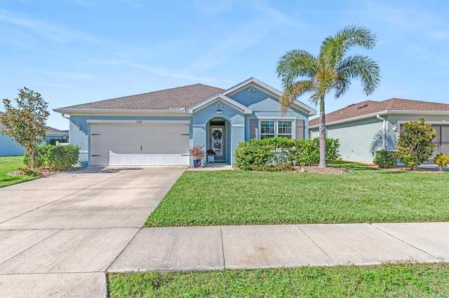 ranch-style house featuring a garage and a front lawn