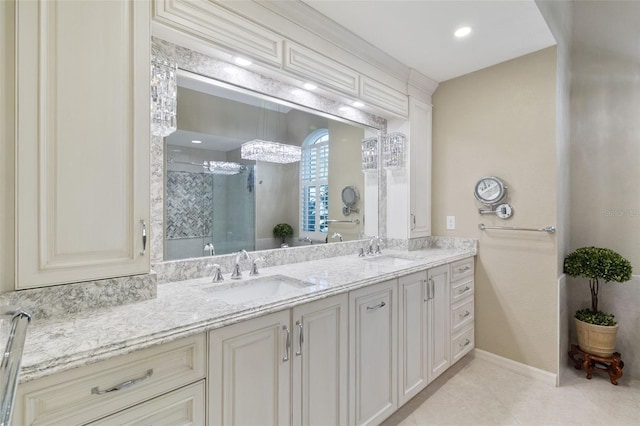 bathroom with tile patterned floors, vanity, and a shower with shower door