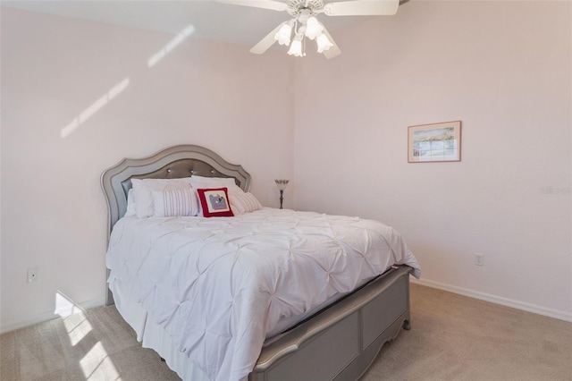 bedroom with light colored carpet and ceiling fan