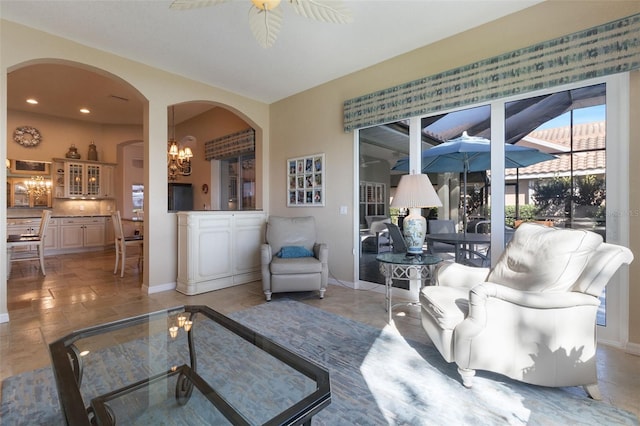 living room with tile patterned floors and ceiling fan