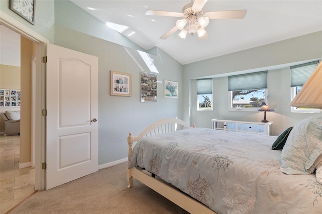 carpeted bedroom with ceiling fan, lofted ceiling, and multiple windows