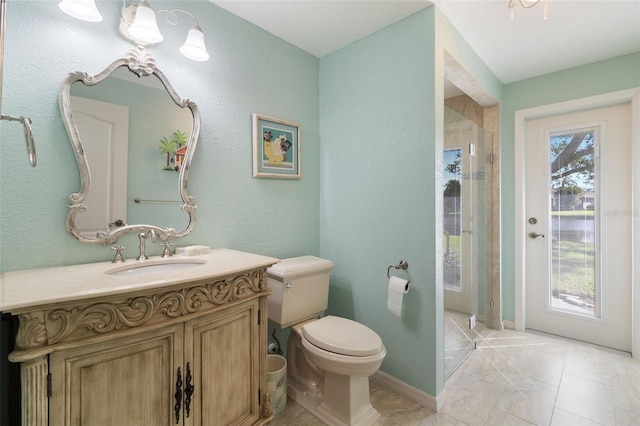 bathroom with vanity, toilet, and walk in shower