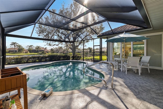 view of swimming pool featuring a lanai and a patio