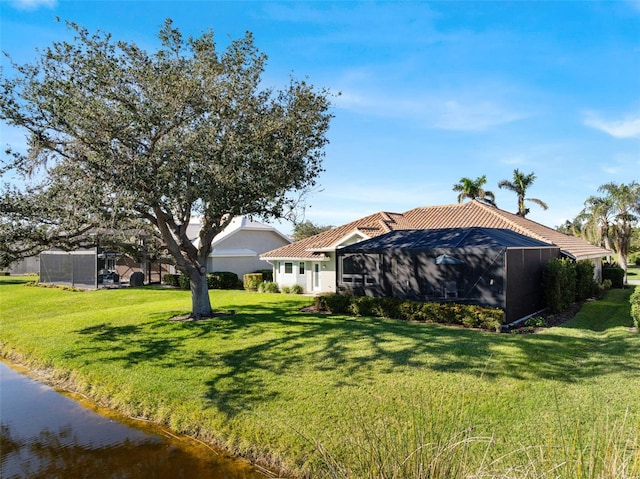 exterior space featuring a lanai and a front yard