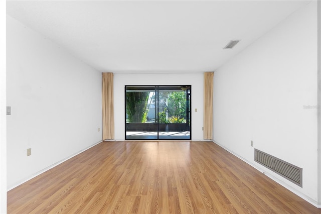 empty room featuring light hardwood / wood-style floors