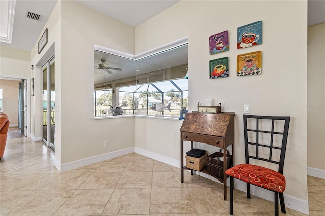 hall featuring light tile patterned flooring