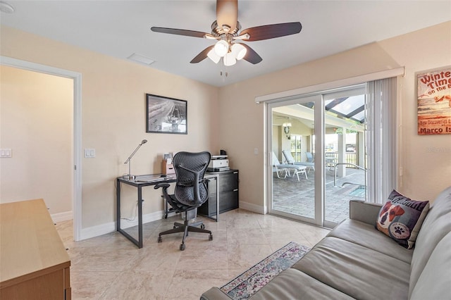 tiled home office featuring ceiling fan