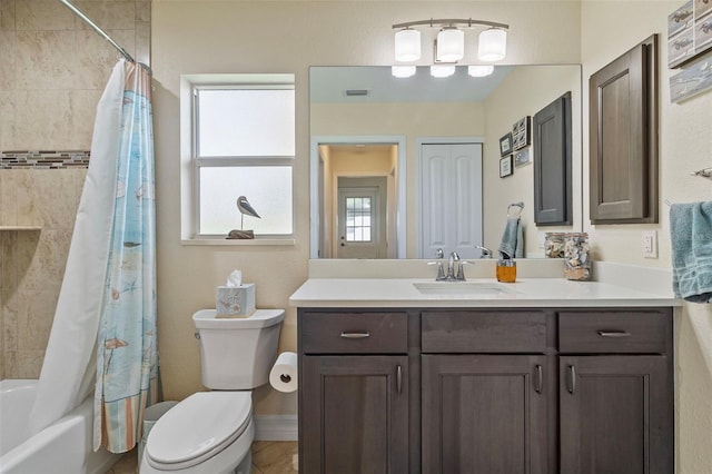 full bathroom with vanity, shower / bathtub combination with curtain, and toilet