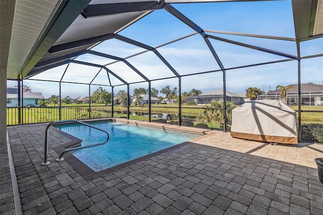 view of swimming pool with a lanai and a patio