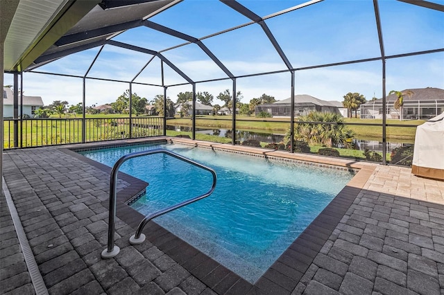 view of pool with a water view, a lanai, and a patio area