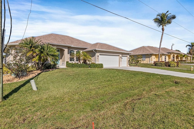 view of front of property with a garage and a front lawn