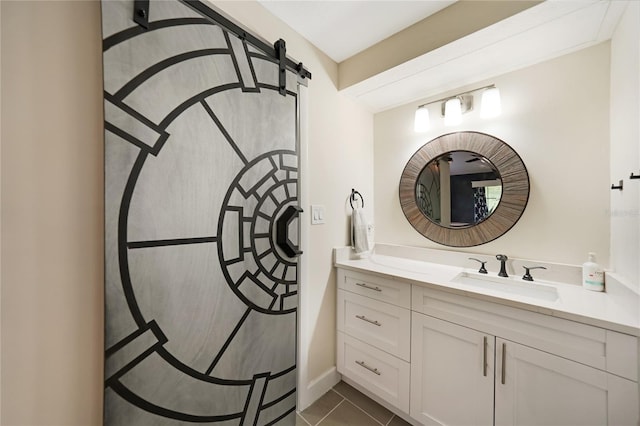 bathroom with tile patterned floors and vanity