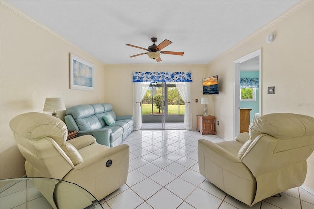 living room with light tile patterned floors, ceiling fan, and crown molding