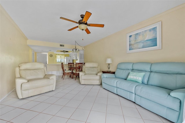 tiled living room featuring ceiling fan and ornamental molding