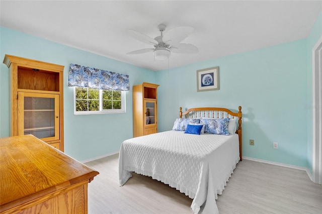 bedroom featuring ceiling fan and light wood-type flooring