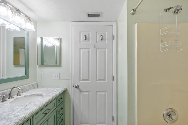 bathroom with vanity and bathing tub / shower combination