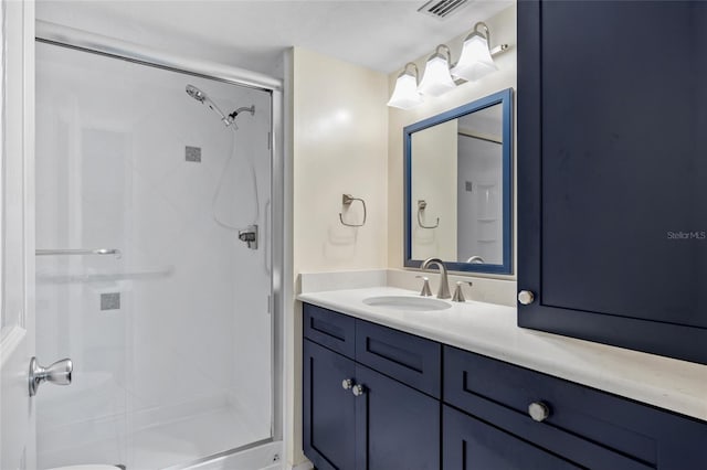 bathroom featuring vanity and an enclosed shower