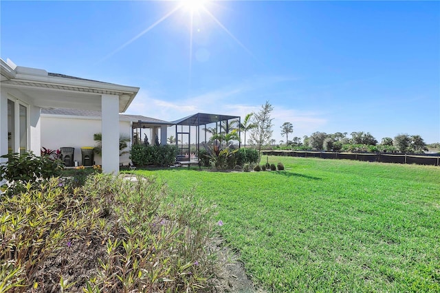 view of yard with a lanai