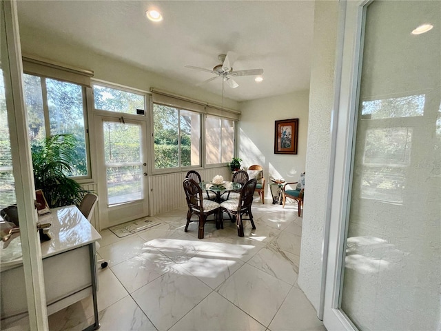 sunroom / solarium with ceiling fan