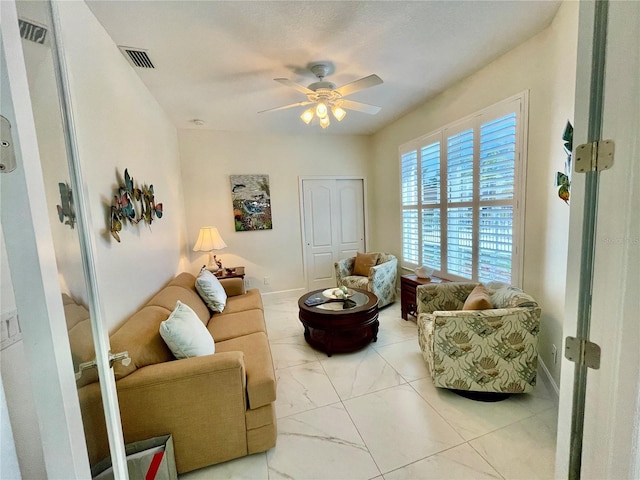 living room with ceiling fan