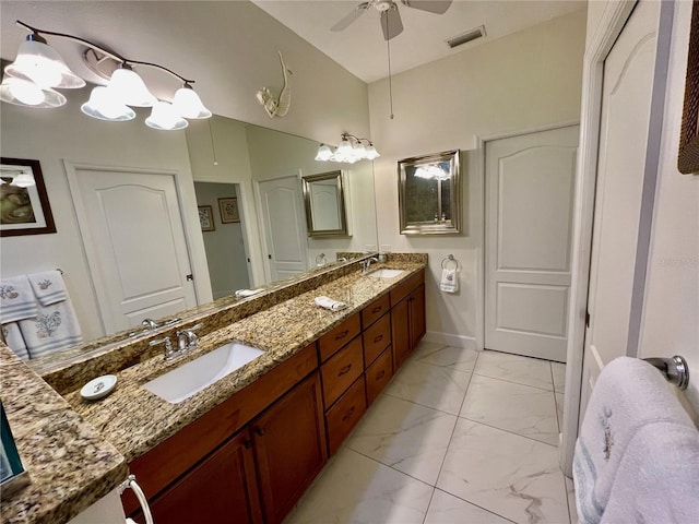 bathroom featuring ceiling fan and vanity